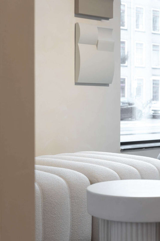 Hand-made art piece Bonne with eco-friendly PLA base, sand texture, on display indoors.