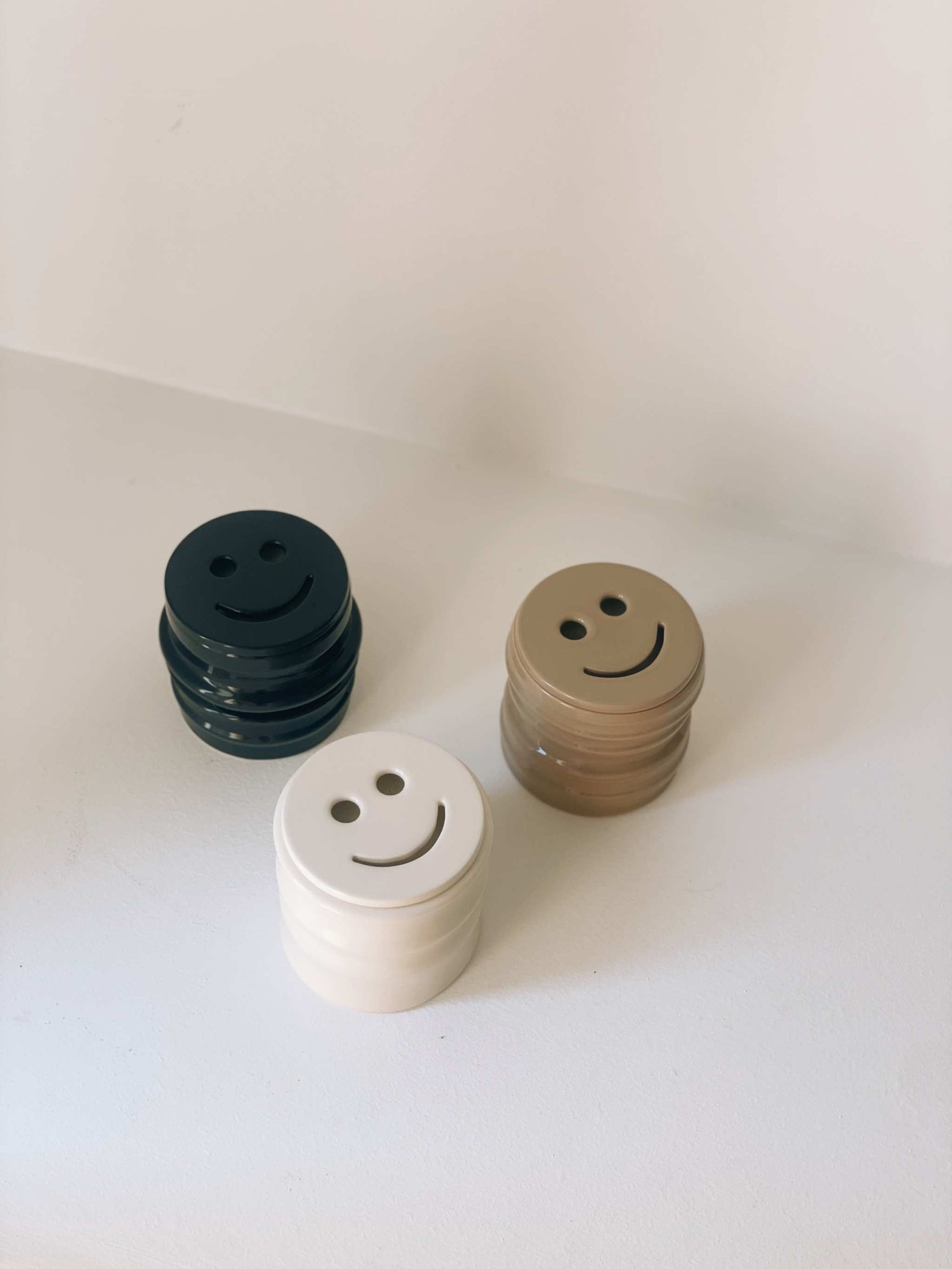 Scented candles in ceramic holders, Shape 03 design, handcrafted collaboration with Royal Goedewaagen, available in various scents.