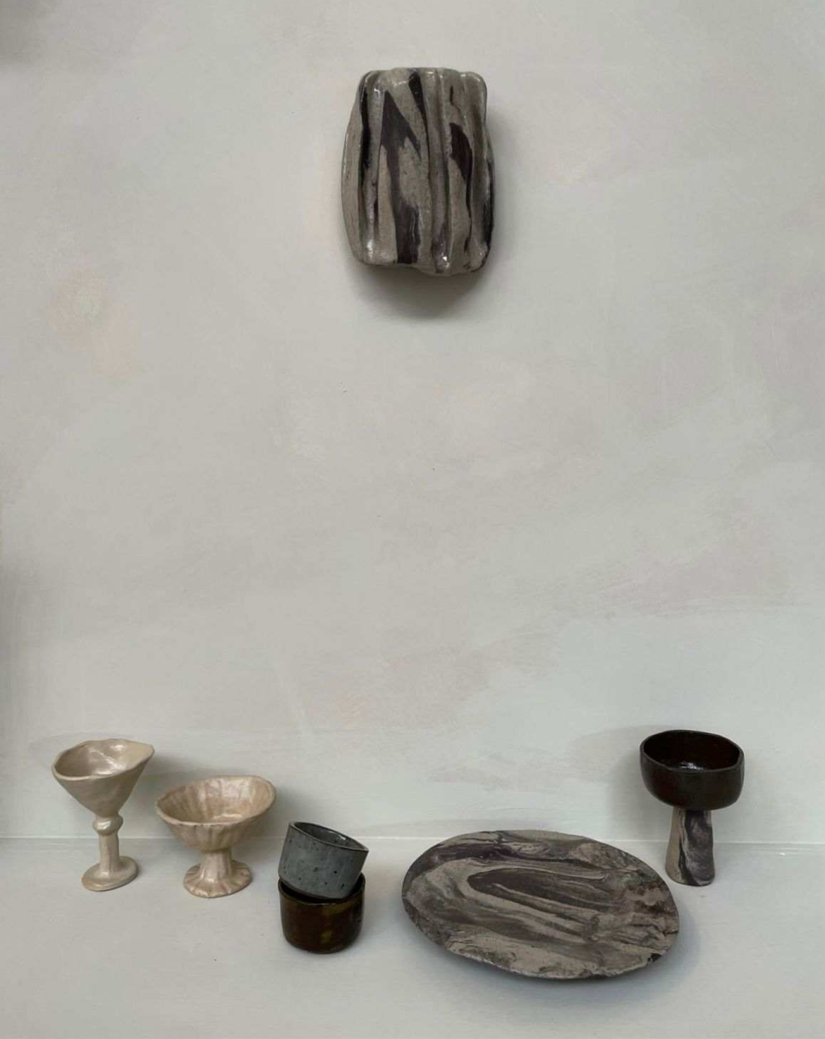 CERAMIC WORKSHOP creations including swirl plates and cups.