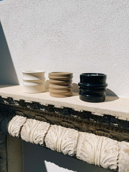 Scented candles in ceramic holders from the Shapes Collection, featuring unique designs by Edith Beurskens and handcrafted by Royal Goedewaagen.