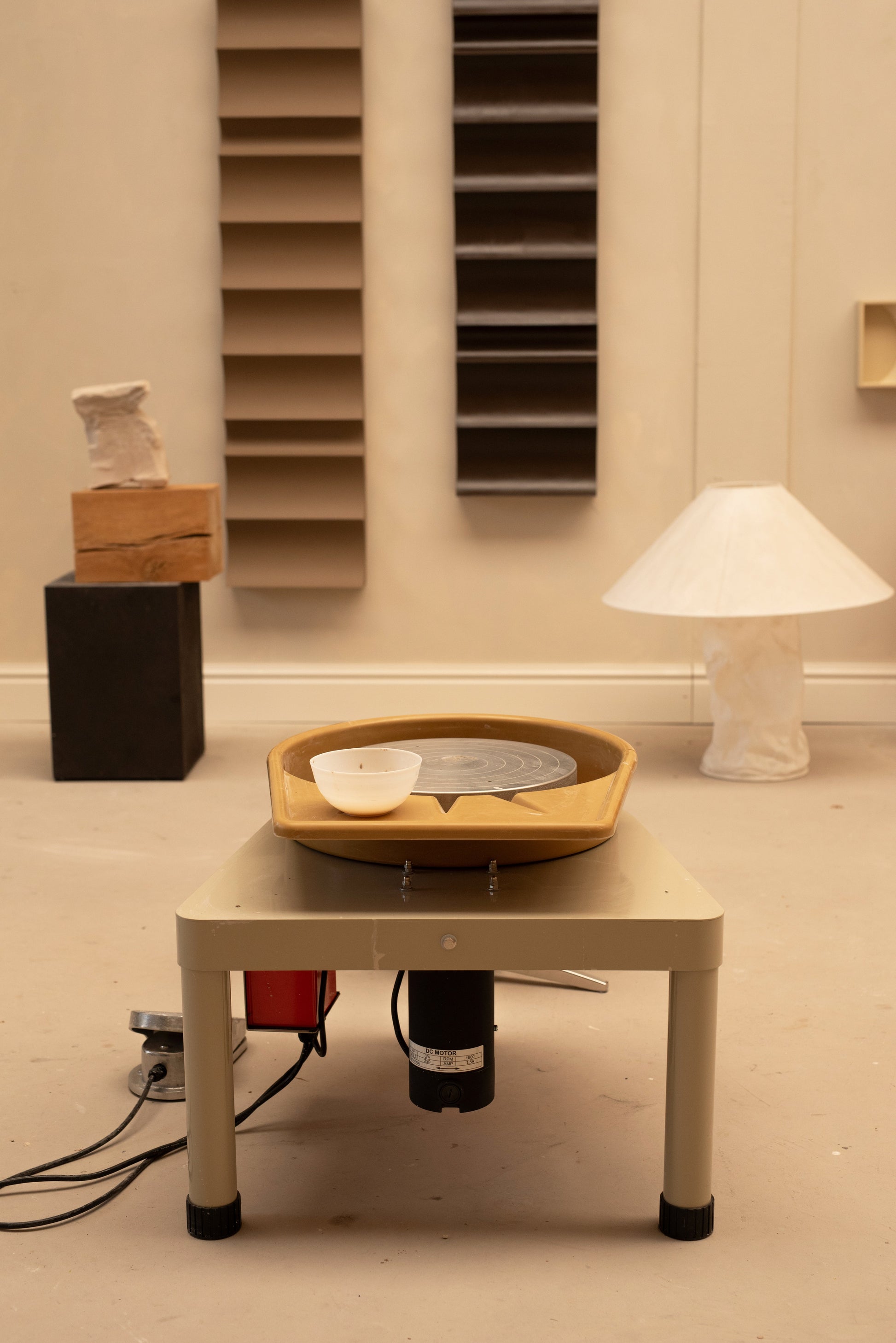 Private throwing wheel lesson setup in a cozy atelier.