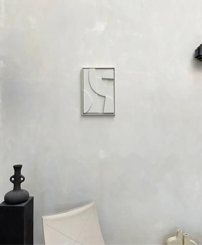 Modern abstract canvas print on wall in minimalist interior setting.