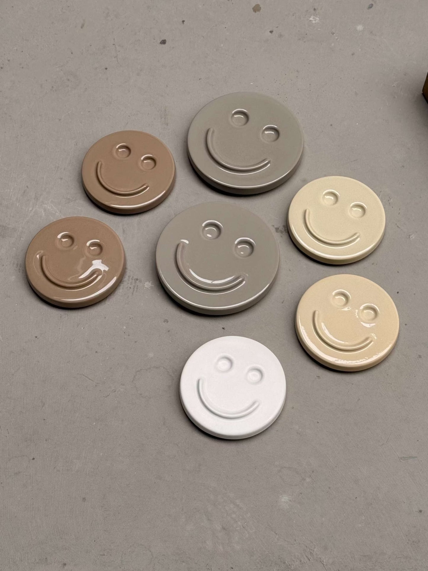 HAPPY ceramic wall art smiley faces in neutral tones handcrafted glazed clay designs