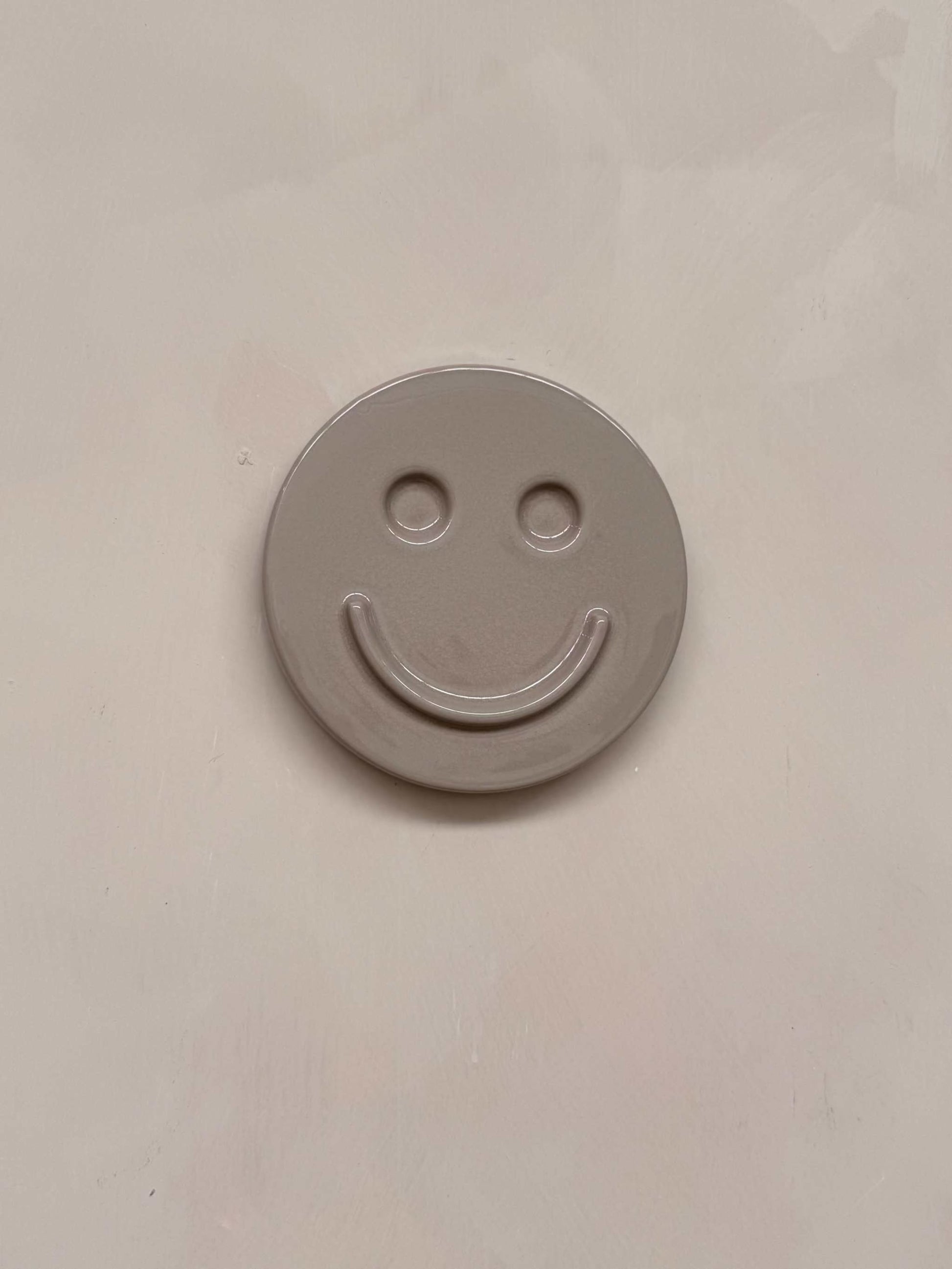 HAPPY ceramic wall art smiley face made from glazed concrete ceramic clay wall decoration