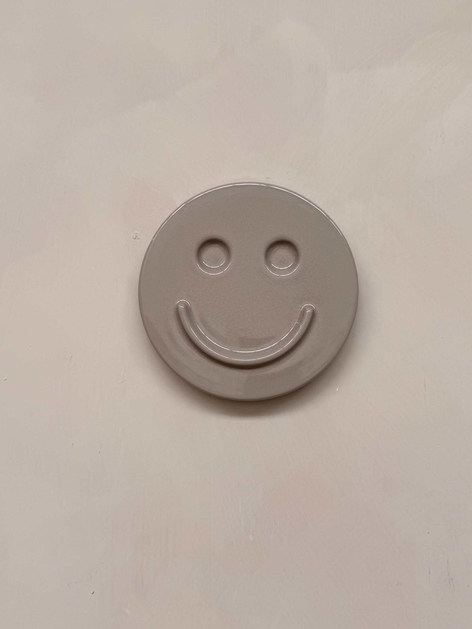 HAPPY ceramic wall art smiley face made of concrete minimalist design