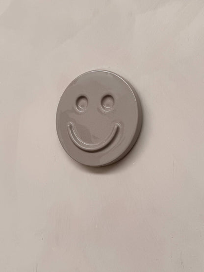 HAPPY ceramic wall art smiley face in concrete color, handcrafted decorative piece for kids room or gifts