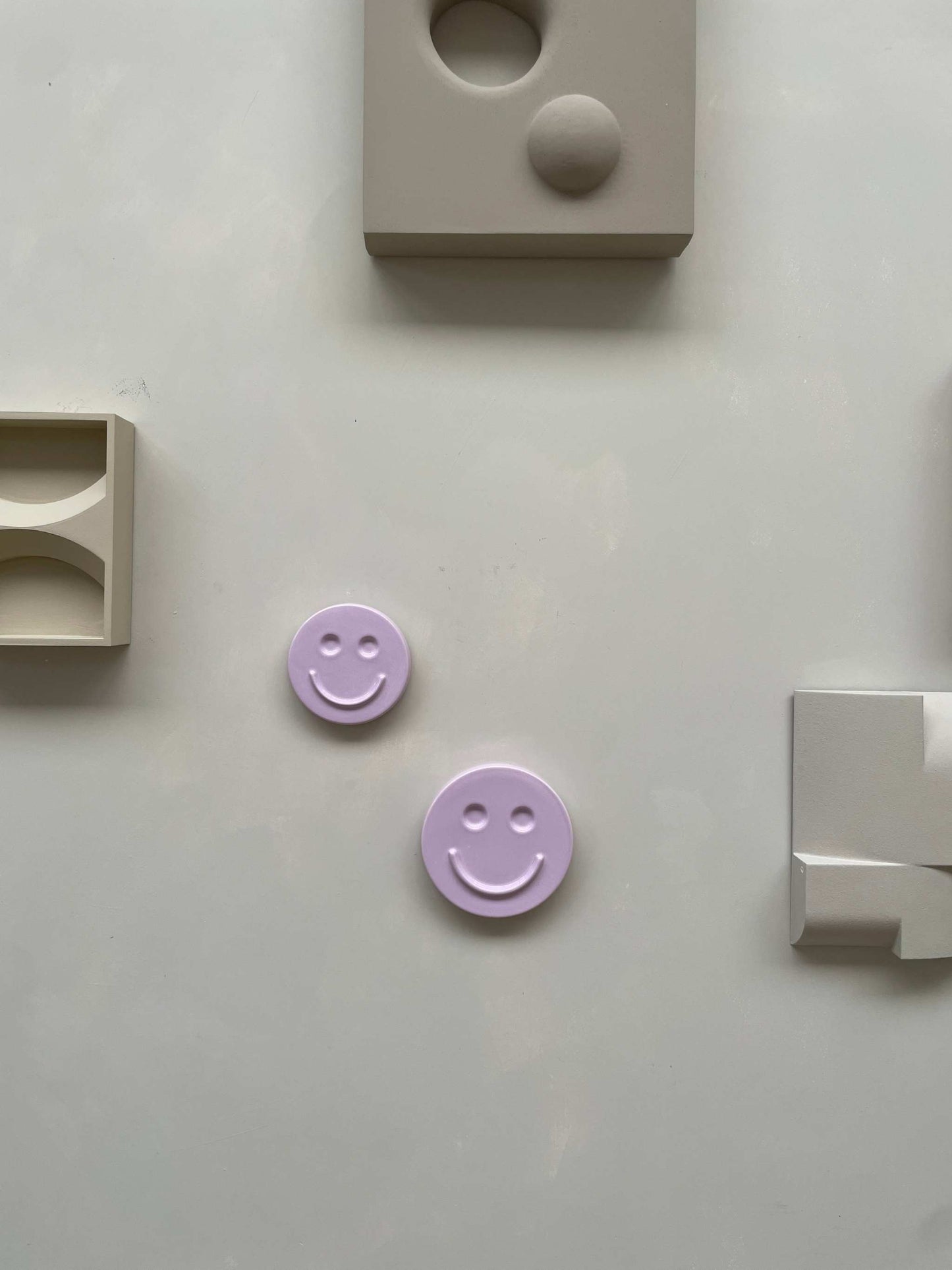 Orchid 'HAPPY' ceramic artwork by Edith Beurskens, smiley face design in glazed ceramic.