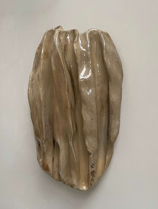 Handcrafted ceramic sculpture "OBJETS DE NOYER - SAND 01" by Edith Beurskens and April van Domburg, featuring organic shapes and flowing lines in walnut-inspired hues.