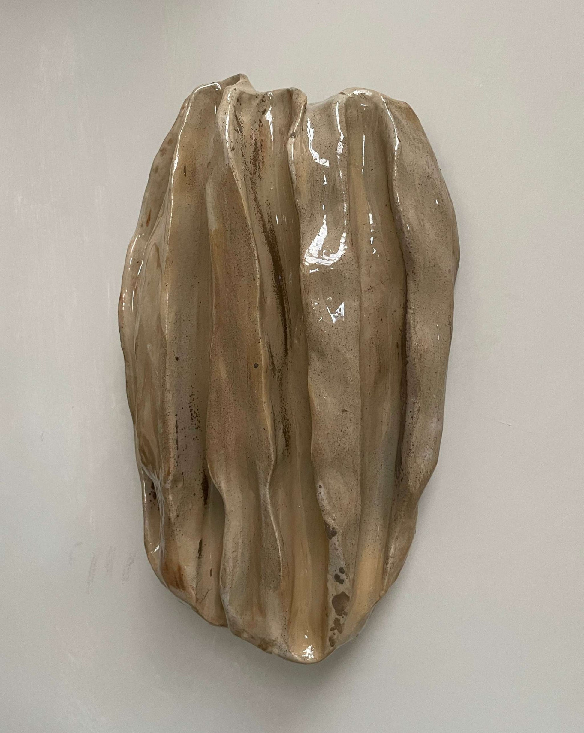 Ceramic sculpture "OBJETS DE NOYER - SAND 01" showcasing organic walnut-inspired shapes and eclectic colors, size 30 x 19 cm.