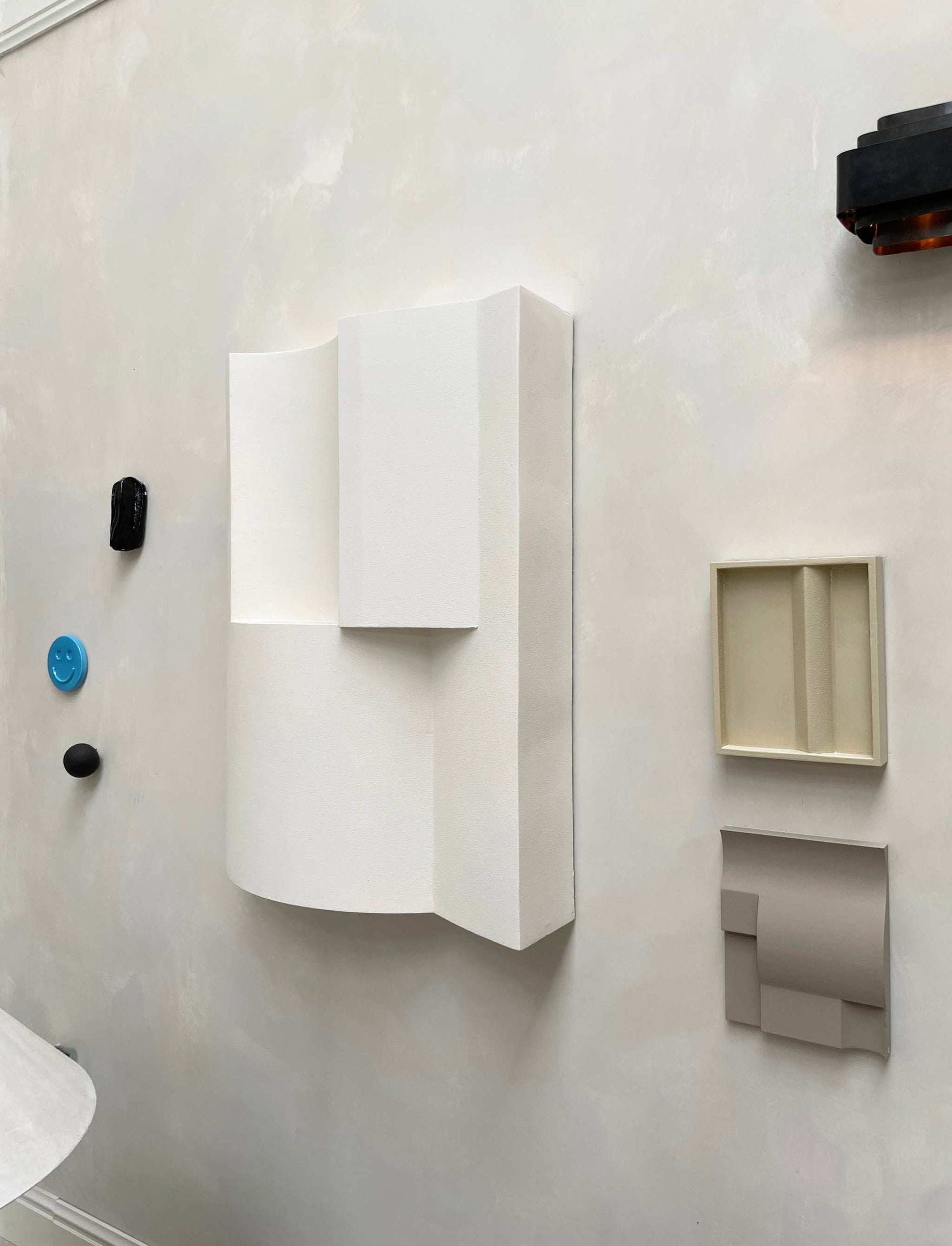 ELEMENT BRUTALIST artwork in Shadow White with structured plaster finish on wall.