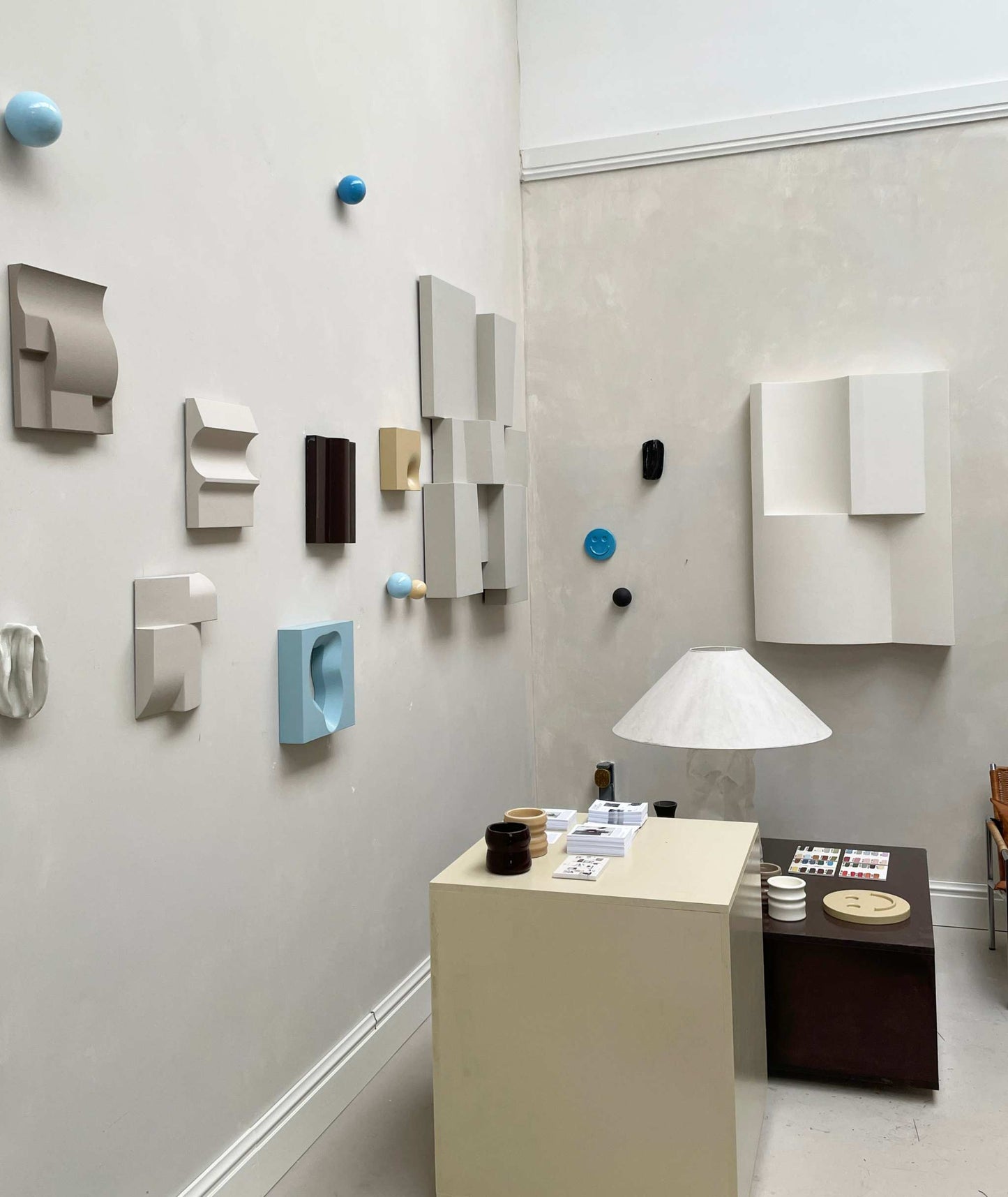 Gallery display of 'ELEMENT BRUTALIST' artworks made from biodegradable PLA with structured plaster finish; includes a Certificate of Authenticity.