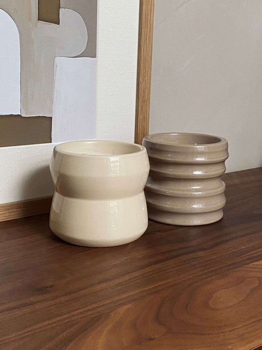 Chalk Shape 02.01 ceramic candle holders from the Scented Candles Shapes Collection, handcrafted by Royal Goedewaagen and Edith Beurskens, displayed on a wooden surface.