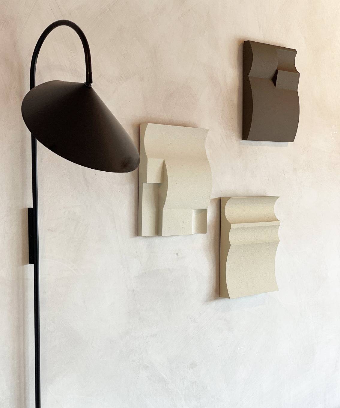 Handmade customizable wall art pieces made from biodegradable PLA with sand texture and eco-paint.