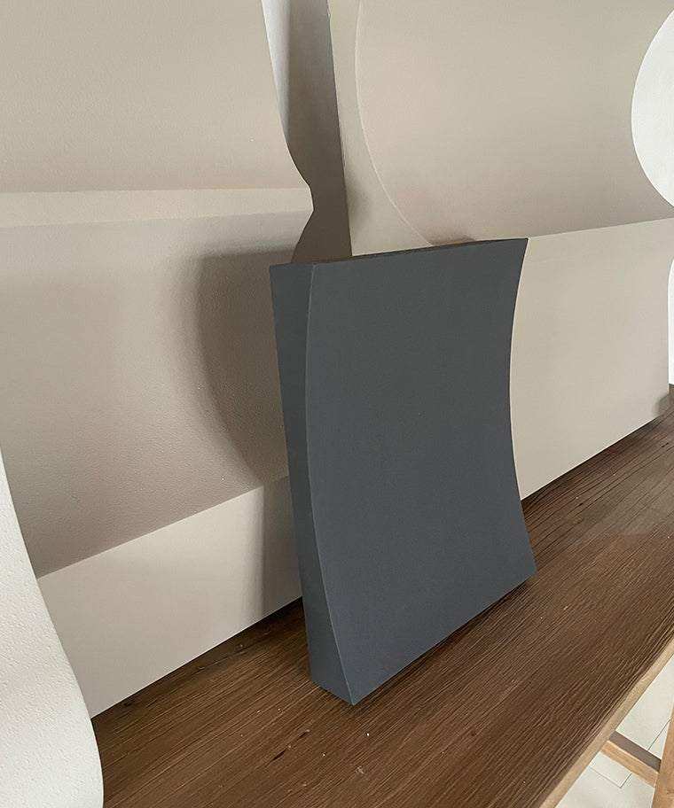 Handmade 22.06 Folding art piece with sand texture on a wooden surface.