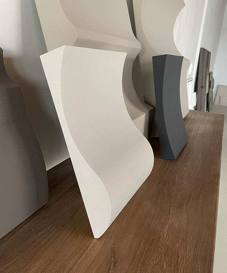 Hand-made 22.06 Folding artwork on wooden surface, available in customizable colors.