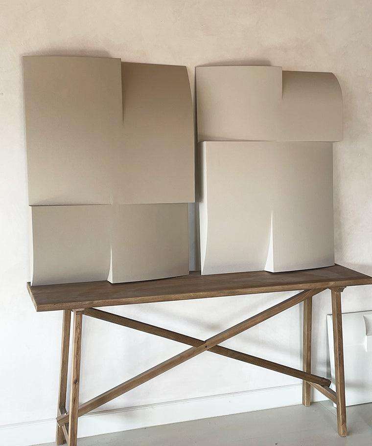 Modern art sculpture 'Journey' with geometric design, handmade from biodegradable PLA, displayed on a wooden table.