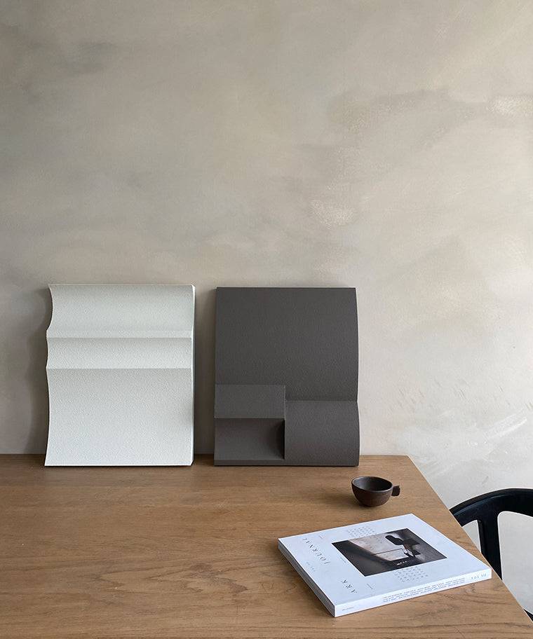 Handmade #22.01 Ark art pieces on wooden table with certificate and cup.