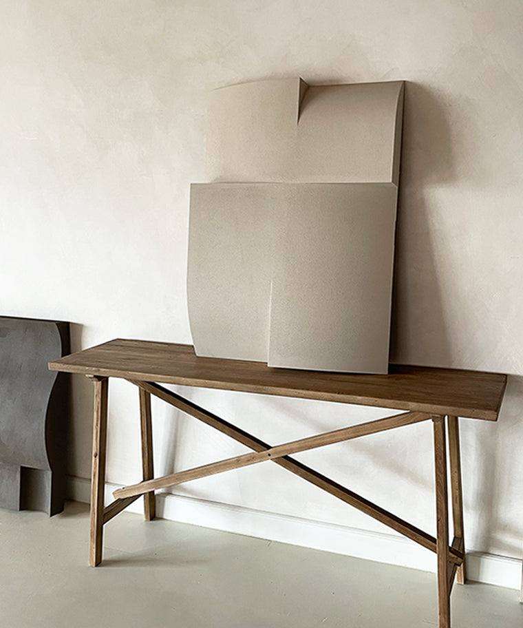 Modern art piece titled '#22.10 Journey' with a sand-textured finish, displayed on a wooden table.