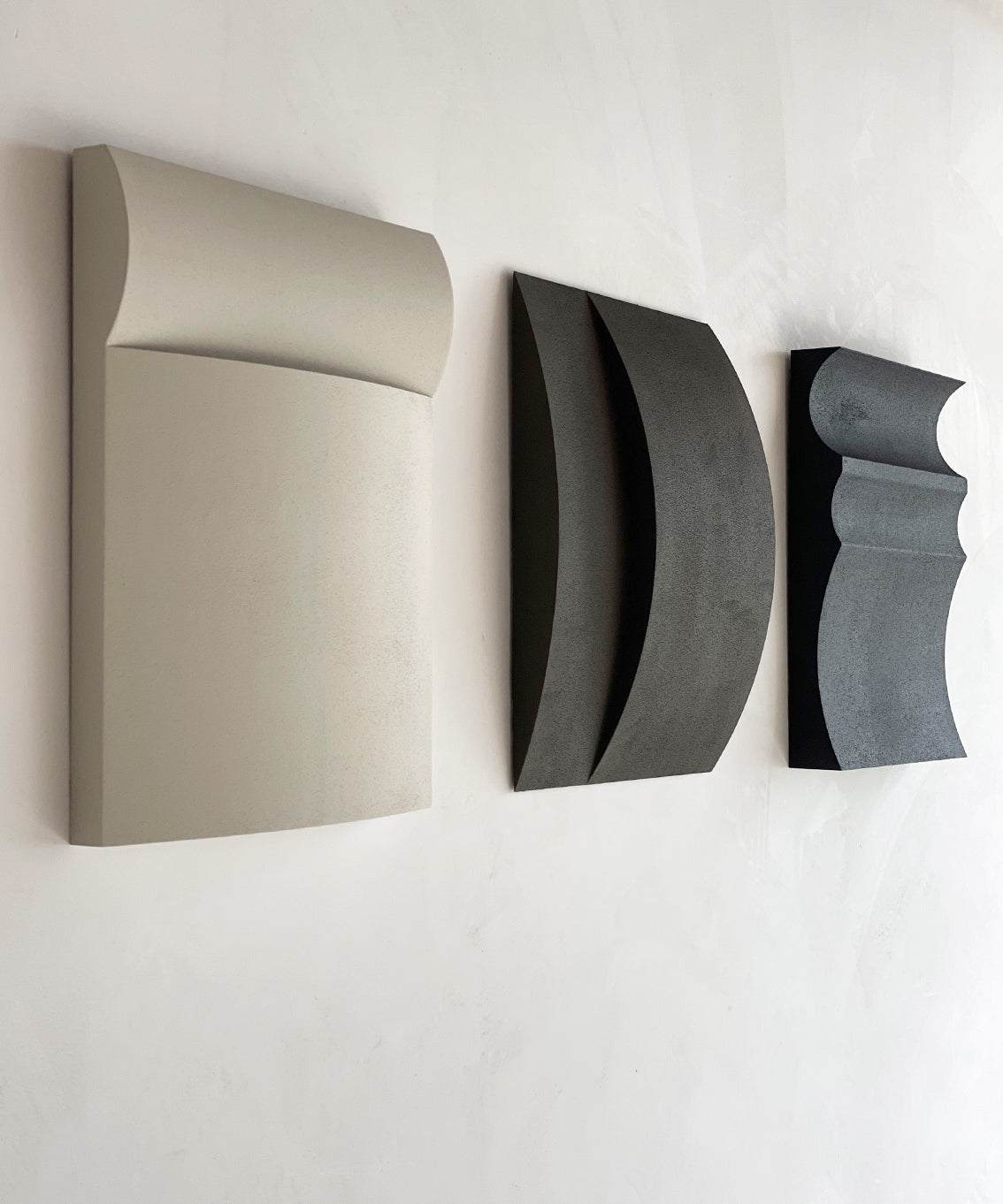 Hand-made wall art with three minimalist panels, eco-painted and sand-textured, titled '#22.01 Ark'.