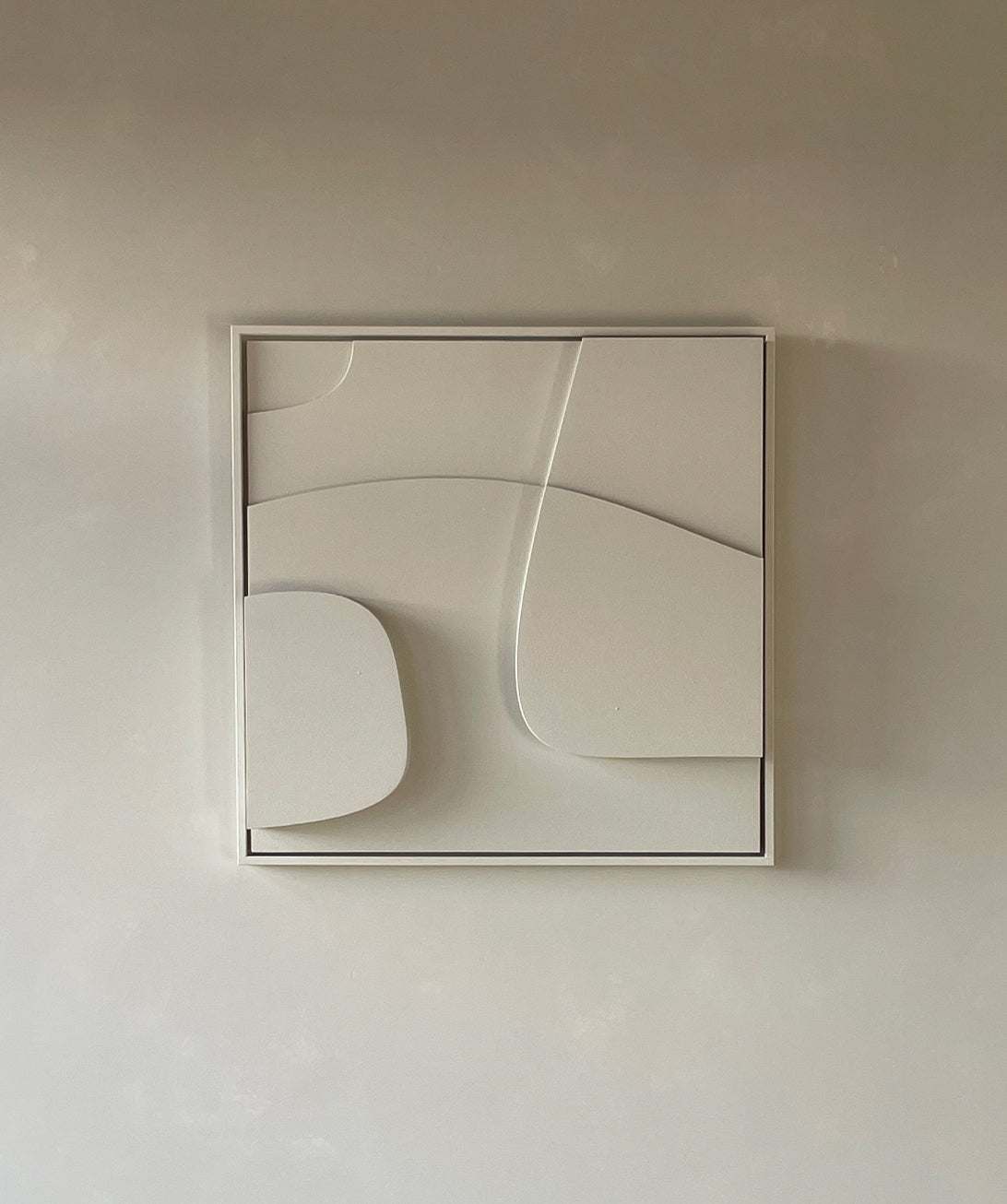 Handcrafted wall art in neutral tones with geometric design, made from biodegradable PLA.
