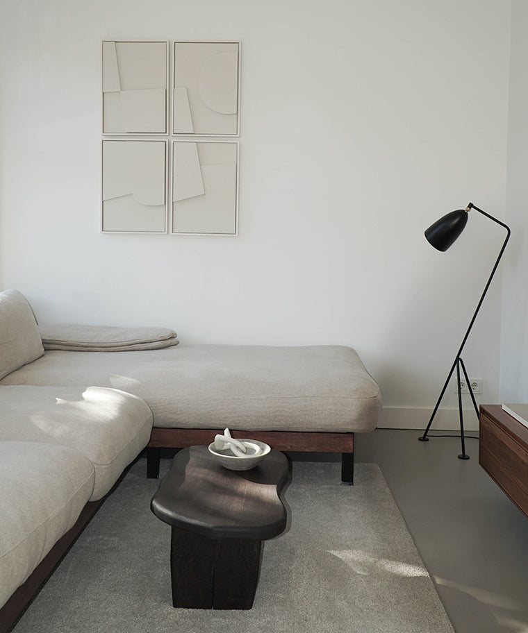 Handmade Quartet art pieces on wall in modern living room setting.