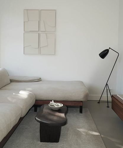 Handmade Quartet art pieces on wall in modern living room setting.