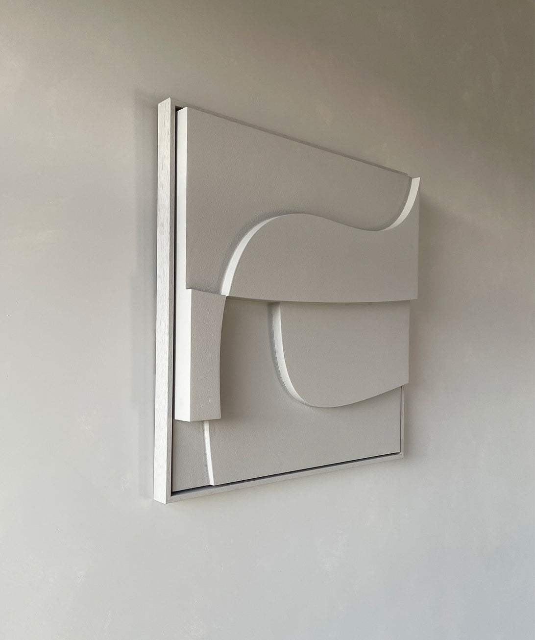 Handmade geometric wall art with sand texture and eco-paint finish.