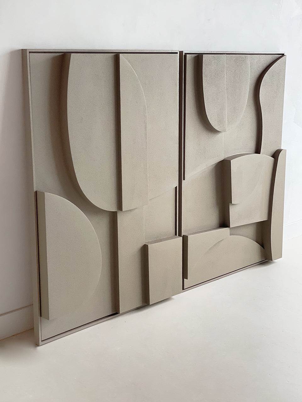 Hand-made biodegradable art piece with abstract design in beige tones.