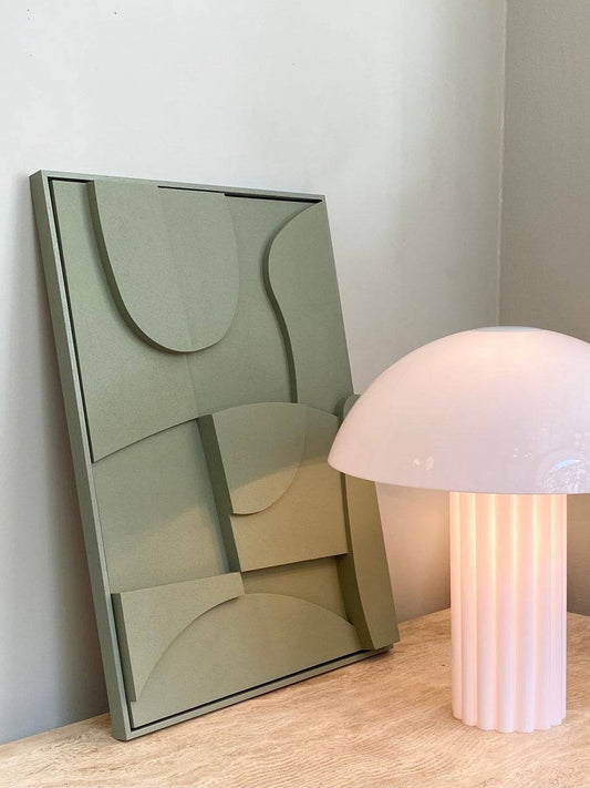 Handmade #20.2 Archi artwork with sand texture finish and eco-paint, placed next to a modern table lamp.