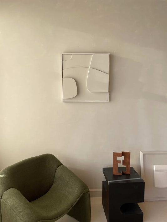 Handmade 3D art piece with abstract design on wall, eco-friendly materials.