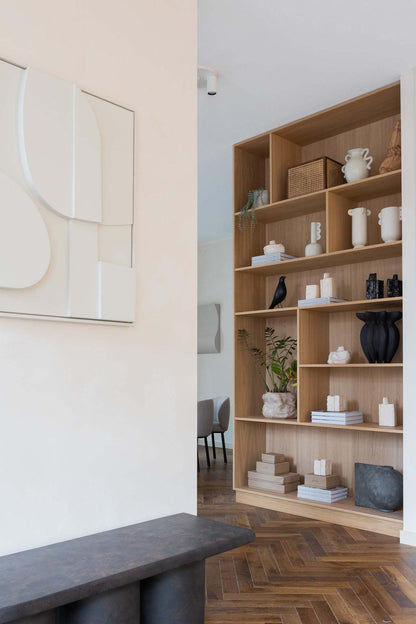 Handmade art piece '#2.1 Blanche' with sand texture and eco-paint displayed in a modern interior setting.